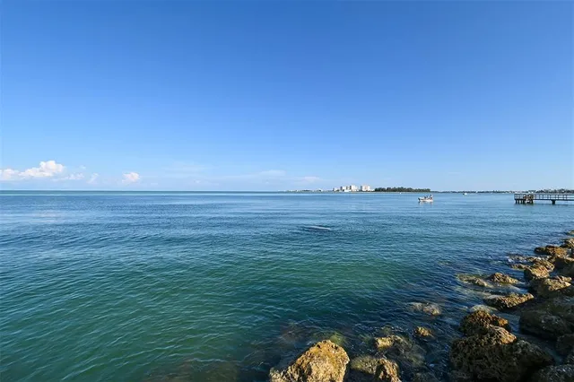 a view of a city with tall buildings and a big yard