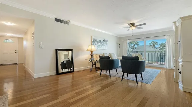 a view of a livingroom with furniture and wooden floor