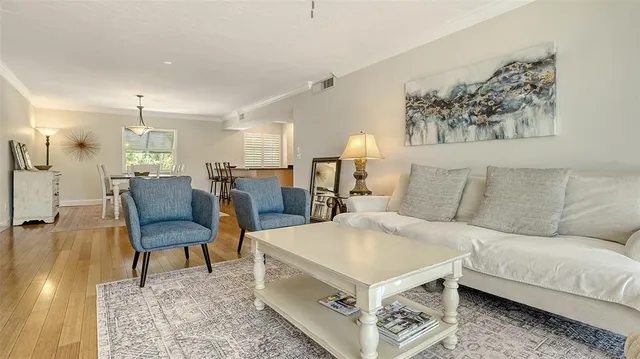 a living room with furniture and a table