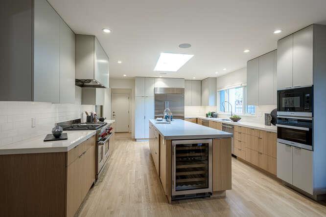 747 Bromfield Road Hillsborough, CA 94010 - Photo 18 of 76 a kitchen with stainless steel appliances granite countertop a stove sink and cabinets