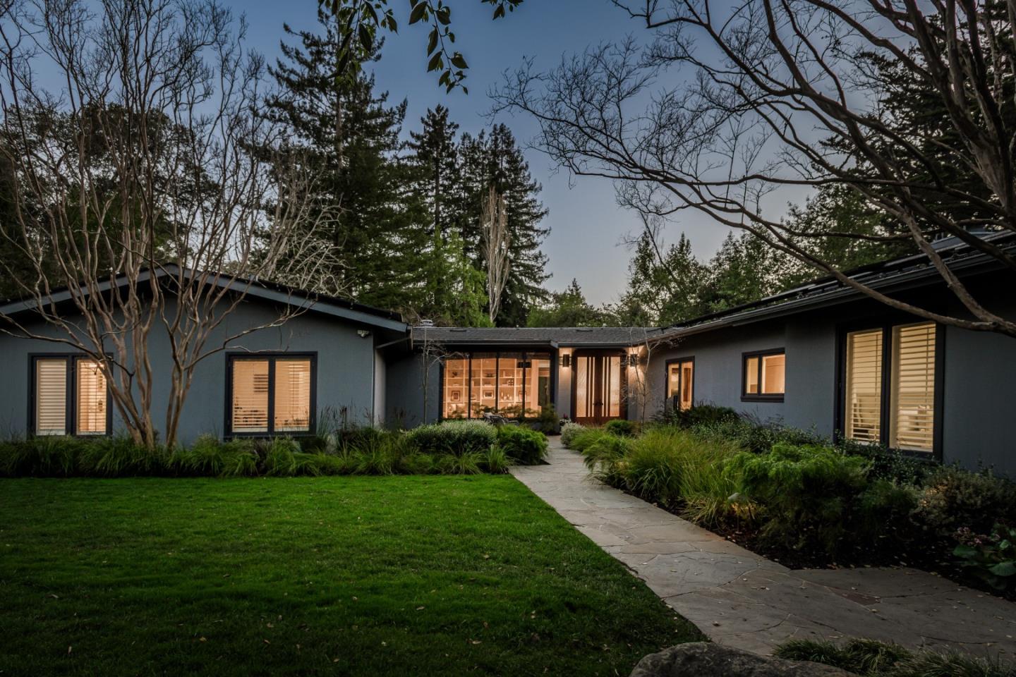 747 Bromfield Road Hillsborough, CA 94010 - Photo 2 of 76 a front view of a house with a yard and garage
