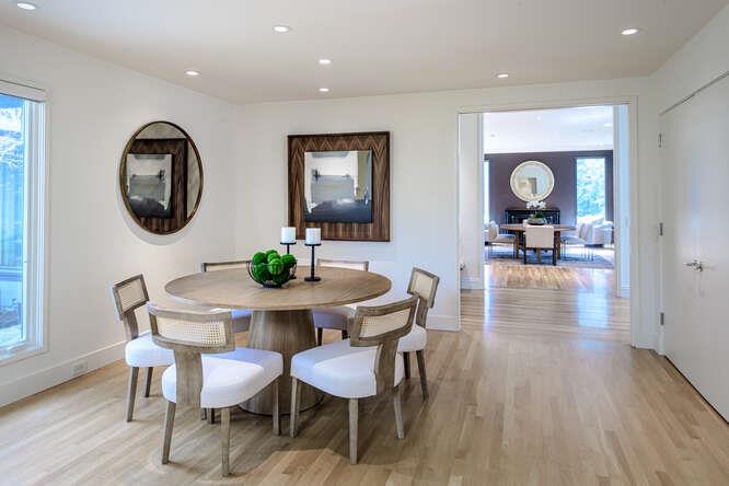 747 Bromfield Road Hillsborough, CA 94010 - Photo 22 of 76 a view of a dining room with furniture and wooden floor