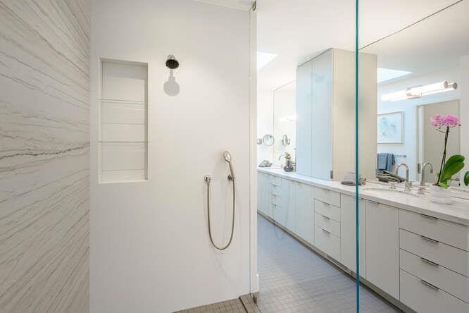 747 Bromfield Road Hillsborough, CA 94010 - Photo 34 of 76 a bathroom with a double sink shower and a mirror