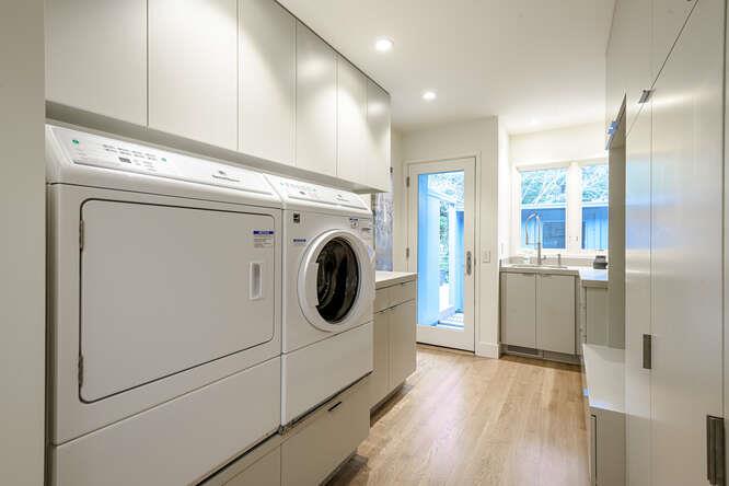 747 Bromfield Road Hillsborough, CA 94010 - Photo 47 of 76 a view of a hallway with washer and dryer