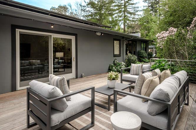 747 Bromfield Road Hillsborough, CA 94010 - Photo 48 of 76 a view of a patio with couches table and chairs and potted plants