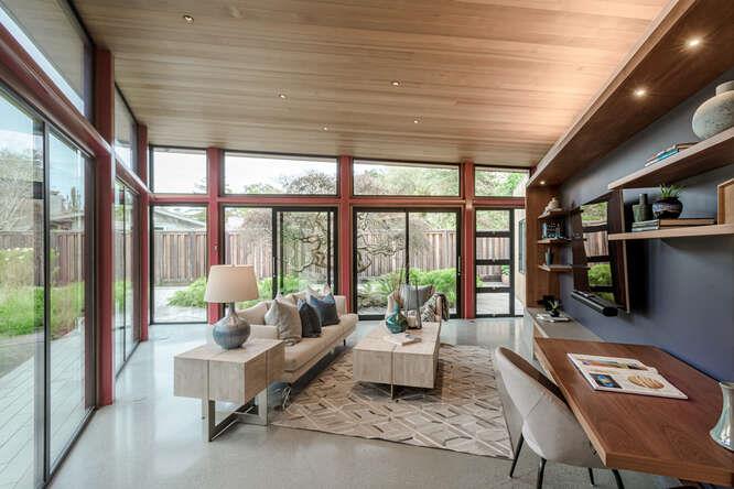 747 Bromfield Road Hillsborough, CA 94010 - Photo 62 of 76 a living room with furniture floor to ceiling window and a flat screen tv
