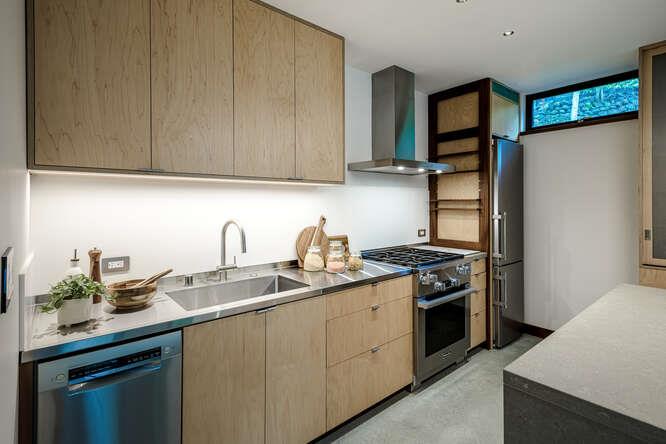 747 Bromfield Road Hillsborough, CA 94010 - Photo 65 of 76 a kitchen with stainless steel appliances granite countertop a sink stove and refrigerator