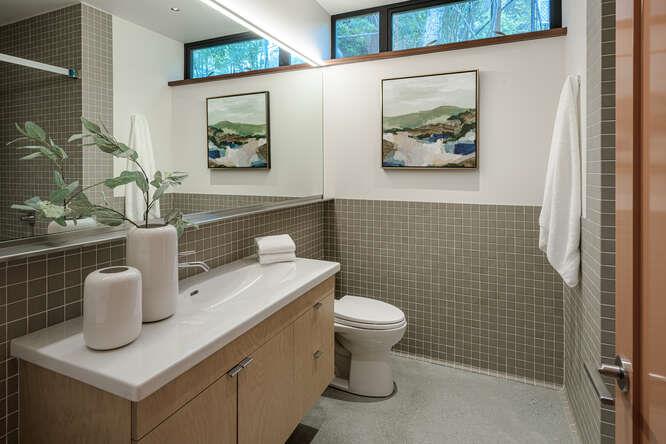747 Bromfield Road Hillsborough, CA 94010 - Photo 72 of 76 a bathroom with a toilet a sink and mirror