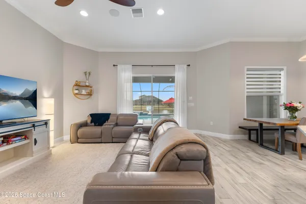 a living room with furniture and a window
