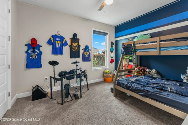 a room with gym equipment and a table