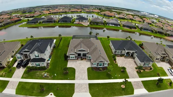 an aerial view of a house with a swimming pool