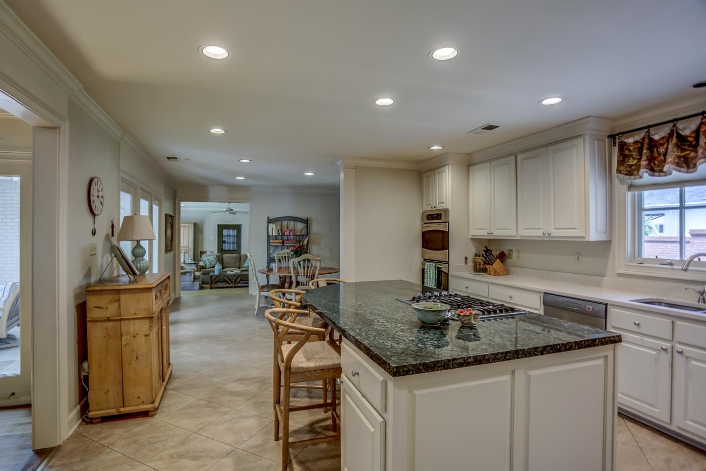 4481 Barfield Road Memphis, TN 38117 - Photo 12 of 32 a kitchen with sink refrigerator and cabinets