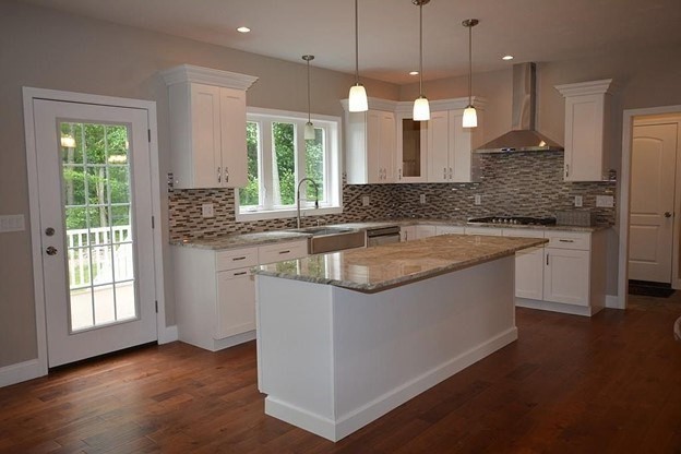 40 Green Street Foxboro, MA 02035 - Photo 4 of 16 a kitchen with granite countertop a sink a counter space appliances and cabinets