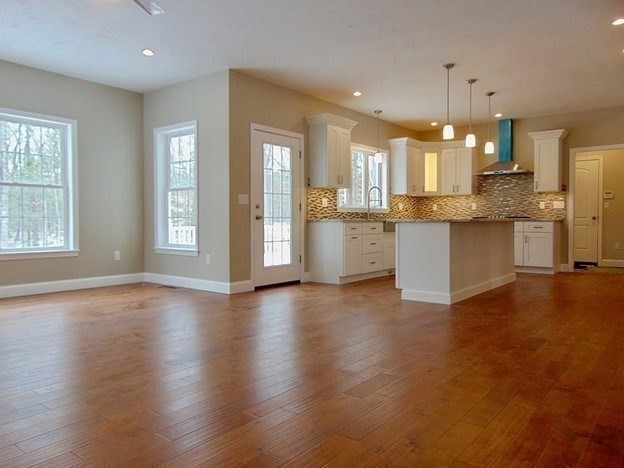 40 Green Street Foxboro, MA 02035 - Photo 5 of 16 a large kitchen with granite countertop a large counter top space a sink stainless steel appliances and cabinets