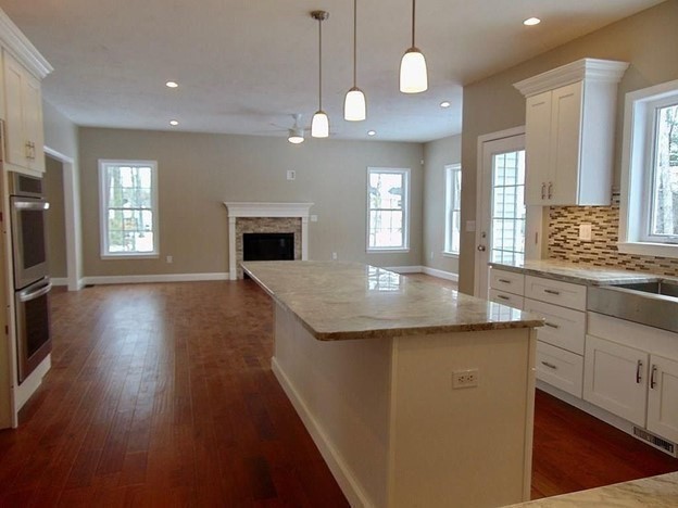 40 Green Street Foxboro, MA 02035 - Photo 6 of 16 a view of a kitchen center island wooden floor and windows