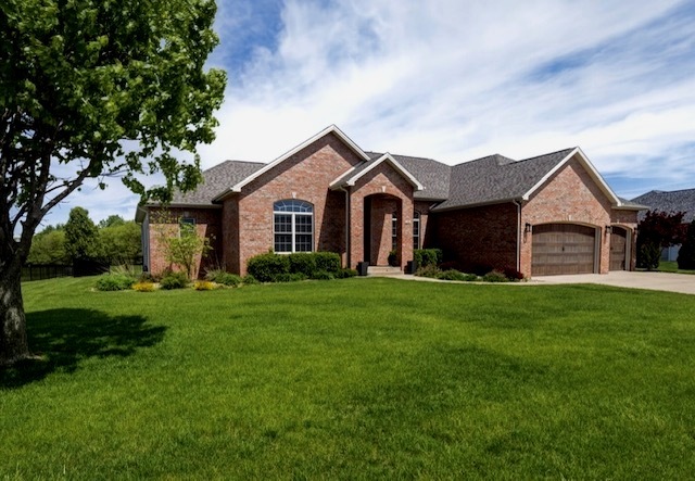 1248 Talon Lane Forsyth, IL 62535 - Photo 11 of 67 a front view of a house with yard and green space