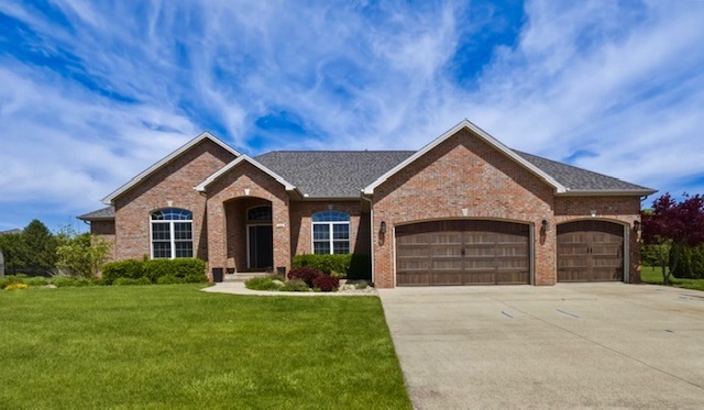 1248 Talon Lane Forsyth, IL 62535 - Photo 17 of 67 a front view of a house with a garden and yard