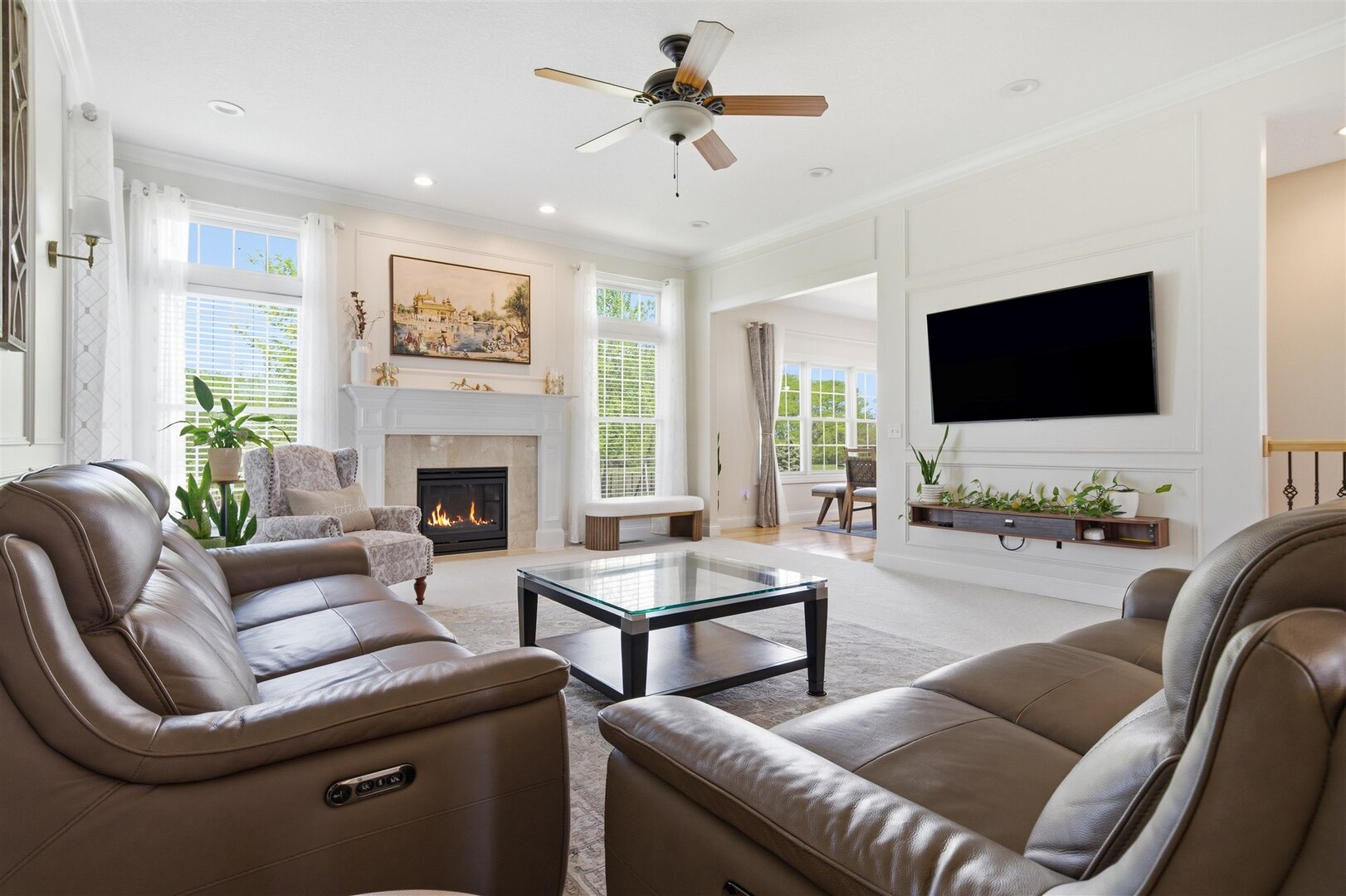 1248 Talon Lane Forsyth, IL 62535 - Photo 25 of 67 a living room with furniture a flat screen tv and a fireplace