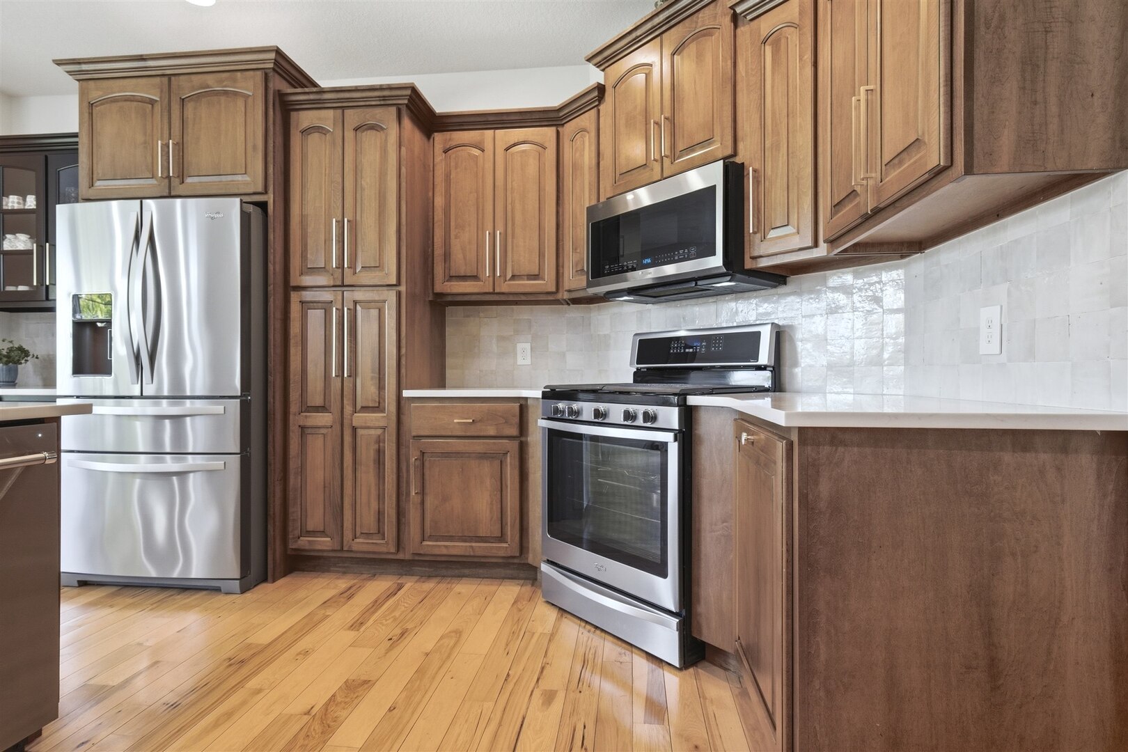1248 Talon Lane Forsyth, IL 62535 - Photo 33 of 67 a kitchen with stainless steel appliances granite countertop a refrigerator microwave and sink