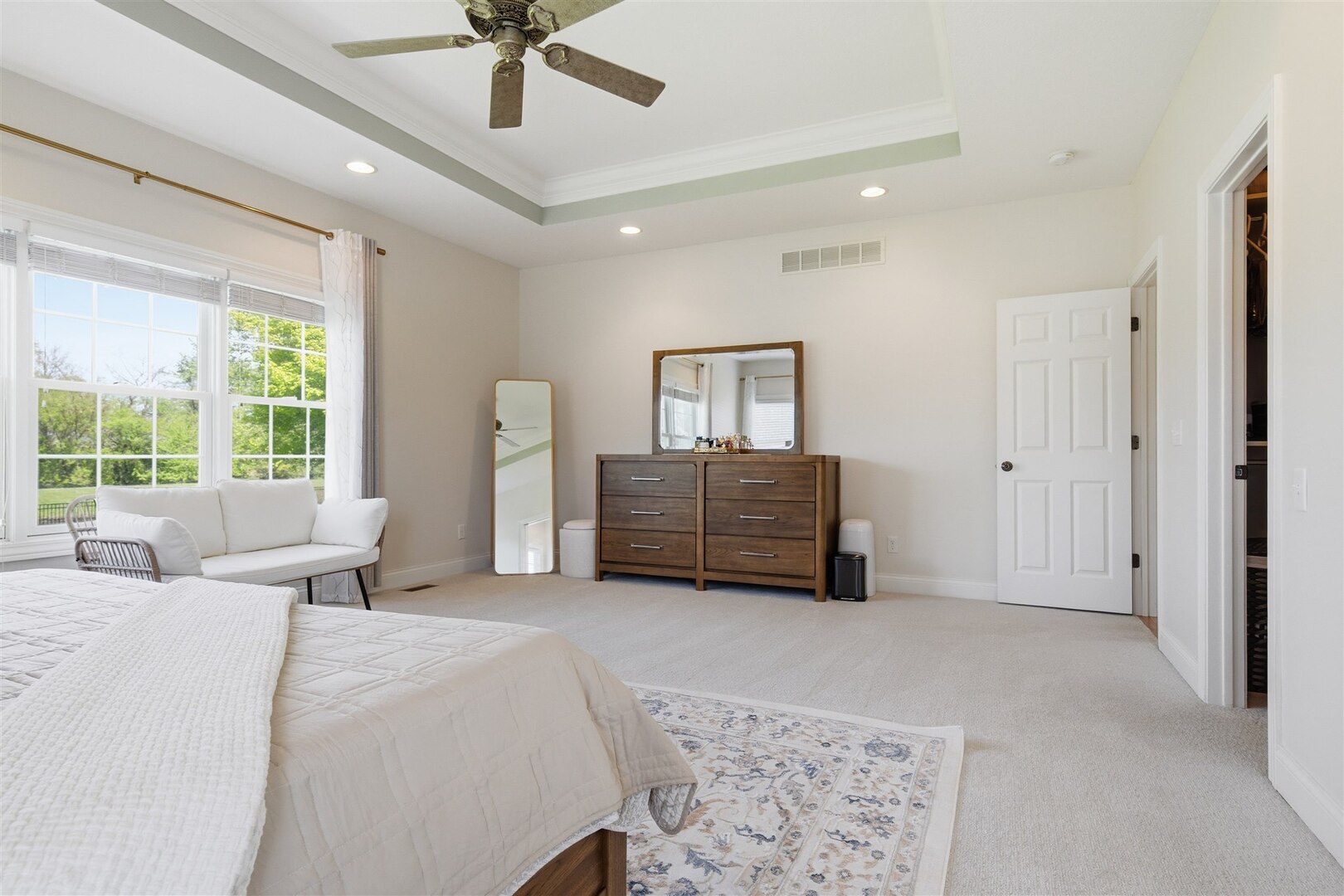 1248 Talon Lane Forsyth, IL 62535 - Photo 40 of 67 a spacious bedroom with a bed windows and a chandelier