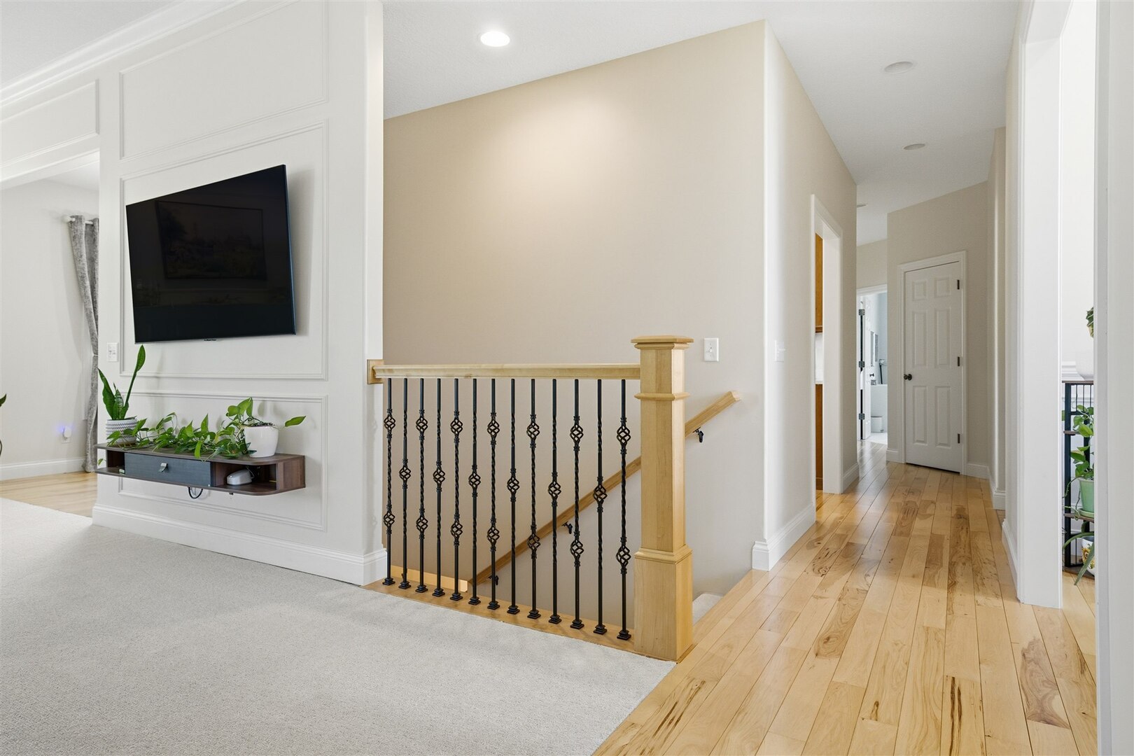 1248 Talon Lane Forsyth, IL 62535 - Photo 47 of 67 a view of a hallway with wooden floor and a flat screen tv