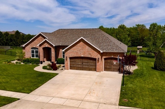 1248 Talon Lane Forsyth, IL 62535 - Photo 56 of 67 a view of house with garden and tall tress