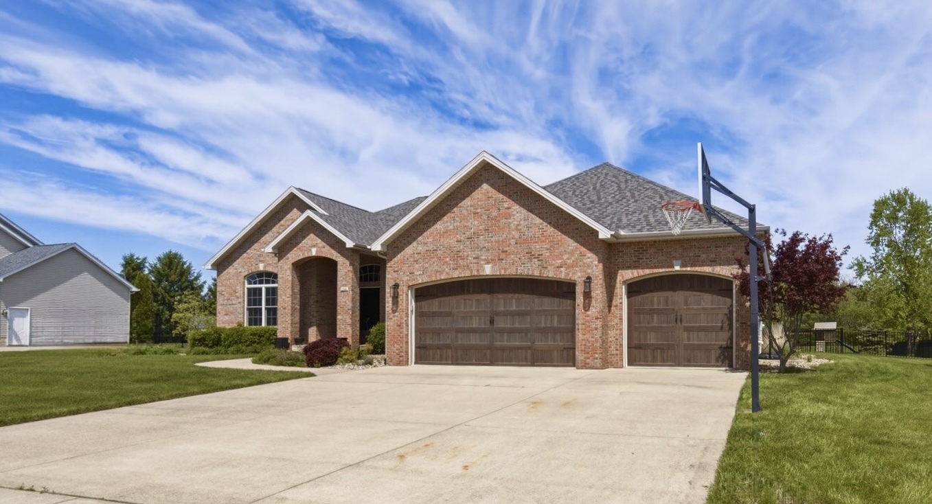 1248 Talon Lane Forsyth, IL 62535 - Photo 10 of 67 a front view of a house with a garden and yard