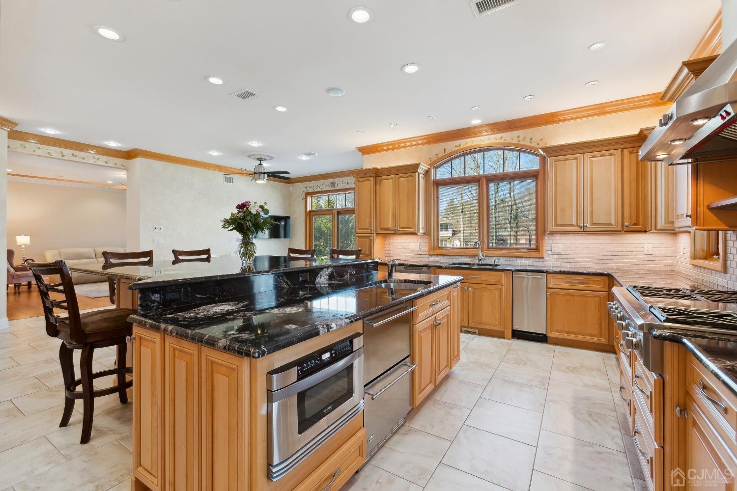 6 Longview Road Edison, NJ 08820 - Photo 23 of 74 a kitchen with stainless steel appliances granite countertop a stove a sink and a refrigerator