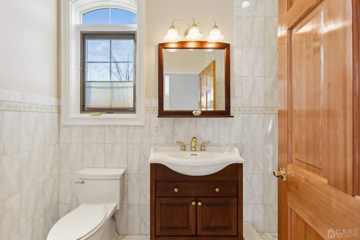 6 Longview Road Edison, NJ 08820 - Photo 25 of 74 a bathroom with a toilet sink and mirror