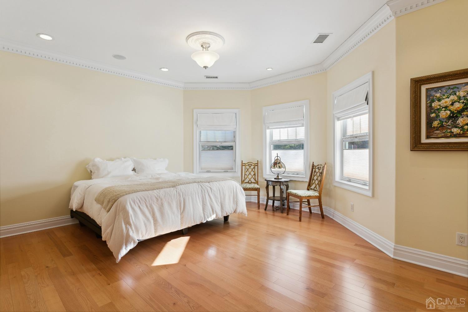6 Longview Road Edison, NJ 08820 - Photo 43 of 74 a spacious bedroom with a bed and a chair