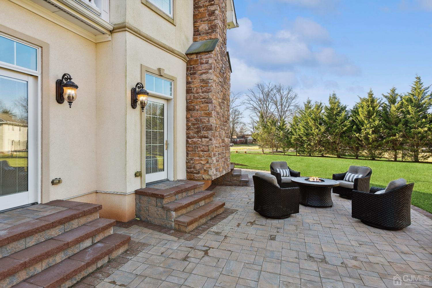 6 Longview Road Edison, NJ 08820 - Photo 52 of 74 a view of a patio with couple of chairs and a fire pit