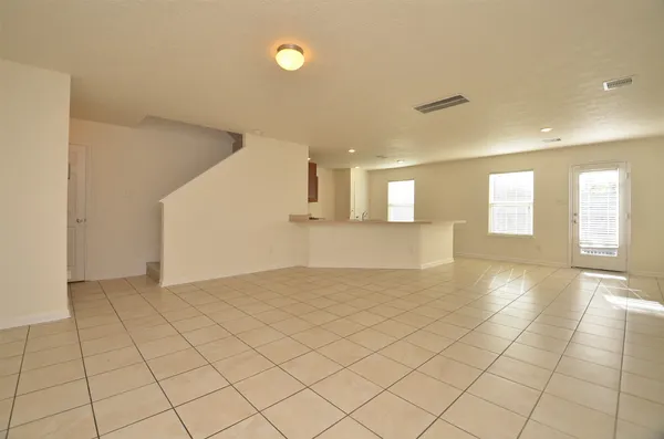 a view of an empty room and window