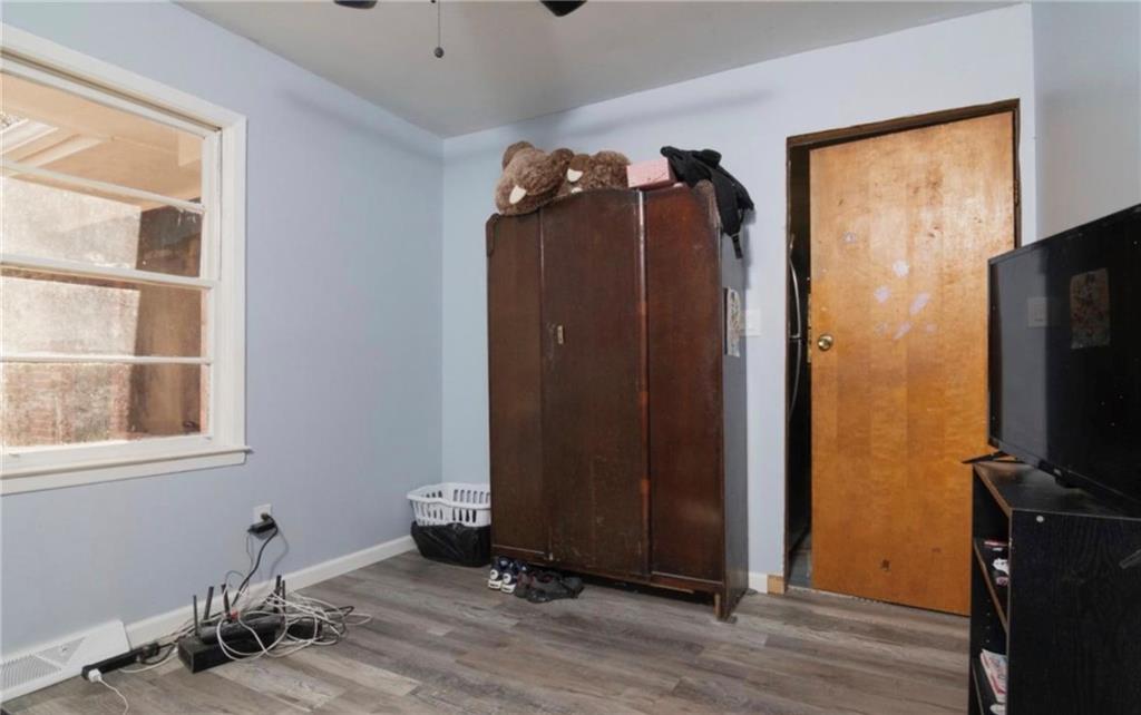 98 Almon Church Road Covington, GA 30014 - Photo 19 of 22 a view of a livingroom with wooden floor and windows
