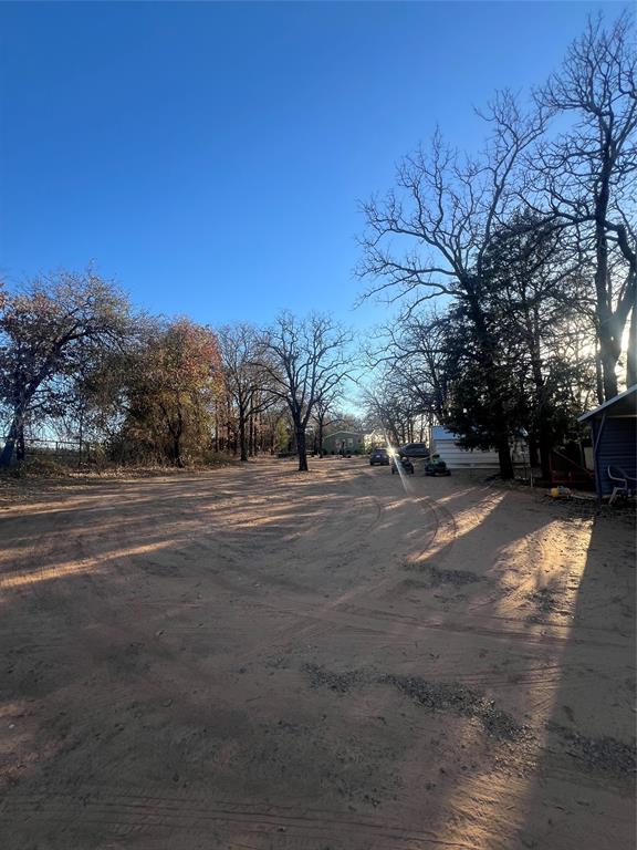 6901 Hawk Road Flower Mound, TX 75022 - Photo 18 of 24 a view of road with a yard