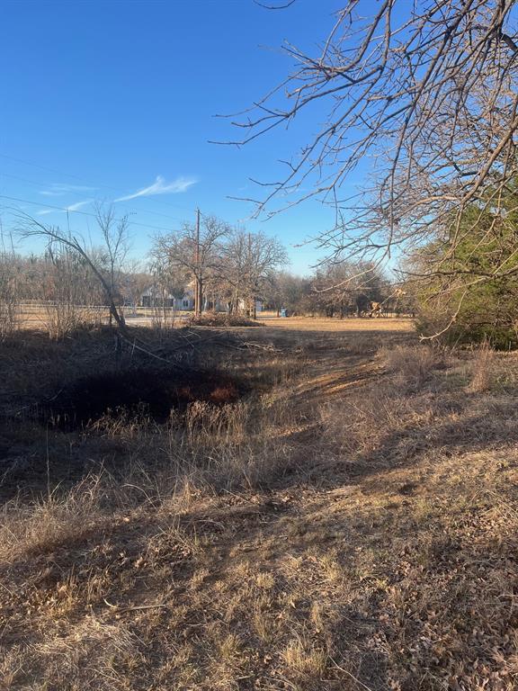 6901 Hawk Road Flower Mound, TX 75022 - Photo 19 of 24 a view of a yard next to a house