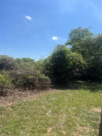 a view of a lake with houses in the background