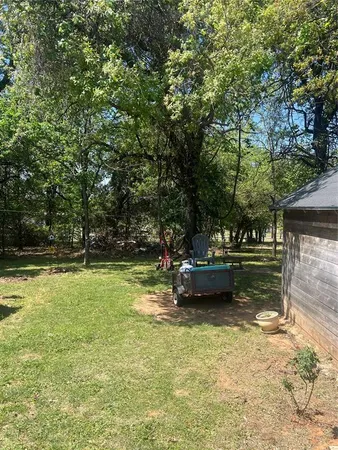 a view of outdoor space with deck and yard