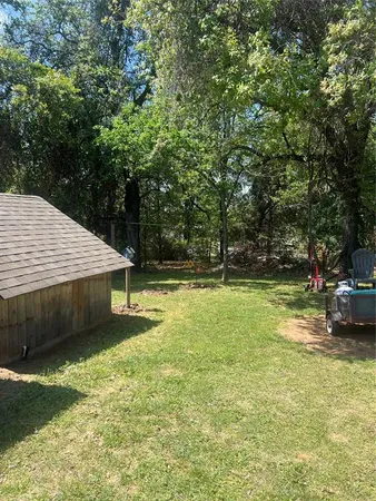 a view of outdoor space with deck and yard