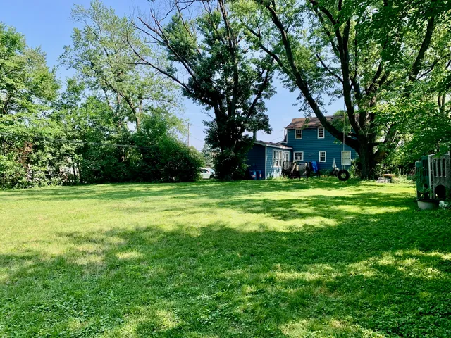 a view of a house with a big yard