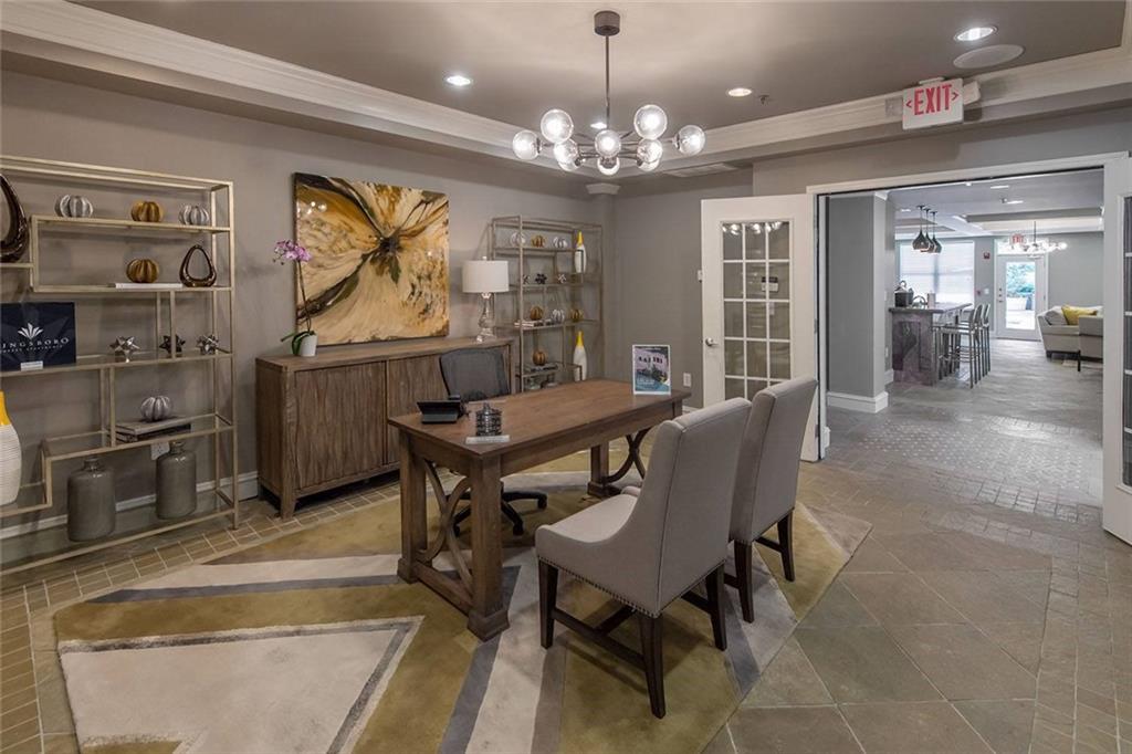 3443 Kingsboro Road Northeast, Unit 1309 Atlanta, GA 30326 - Photo 14 of 17 a view of a dining room with furniture and chandelier