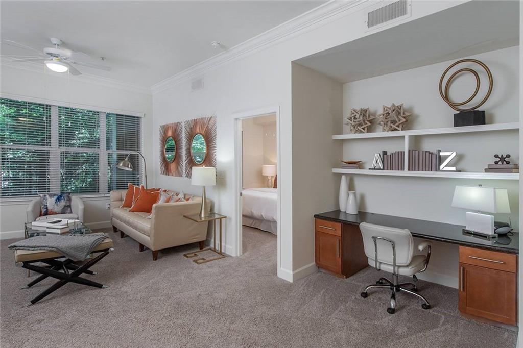 3443 Kingsboro Road Northeast, Unit 1309 Atlanta, GA 30326 - Photo 3 of 17 a living room with furniture and a window