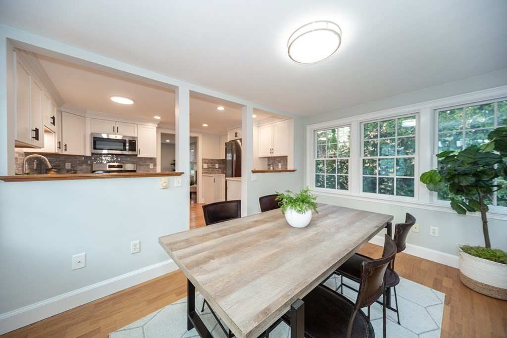 2 A Circular Avenue Natick, MA 01760 - Photo 12 of 29 a kitchen with a table and chairs in it