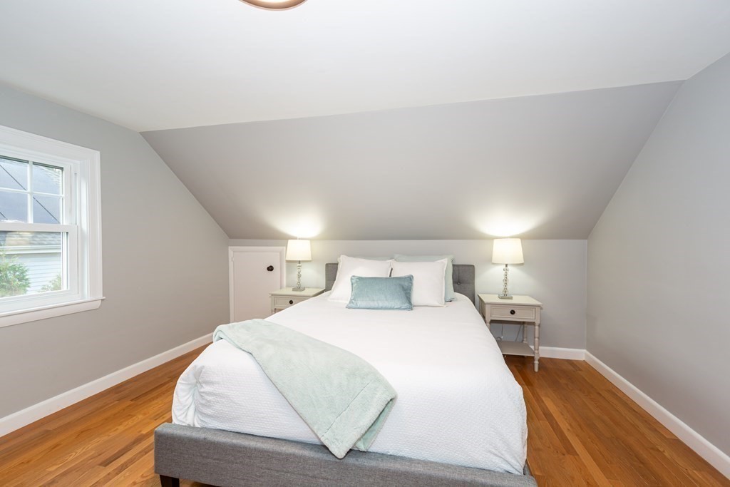 2 A Circular Avenue Natick, MA 01760 - Photo 17 of 29 a bedroom with a bed and wooden floor