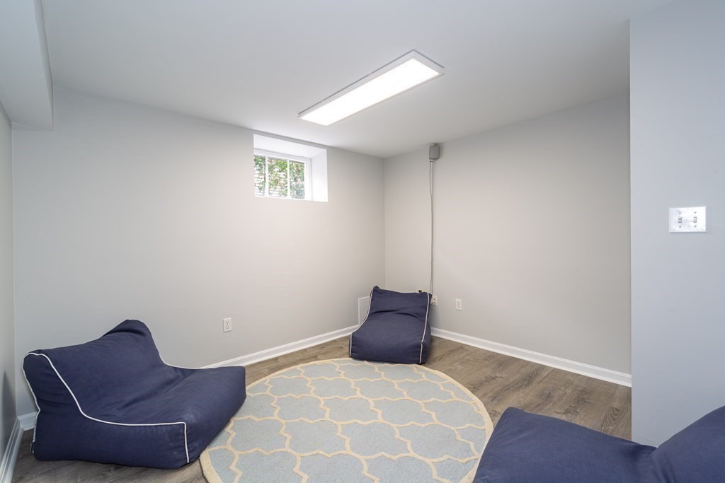 2 A Circular Avenue Natick, MA 01760 - Photo 23 of 29 a bedroom with a bed and a couch
