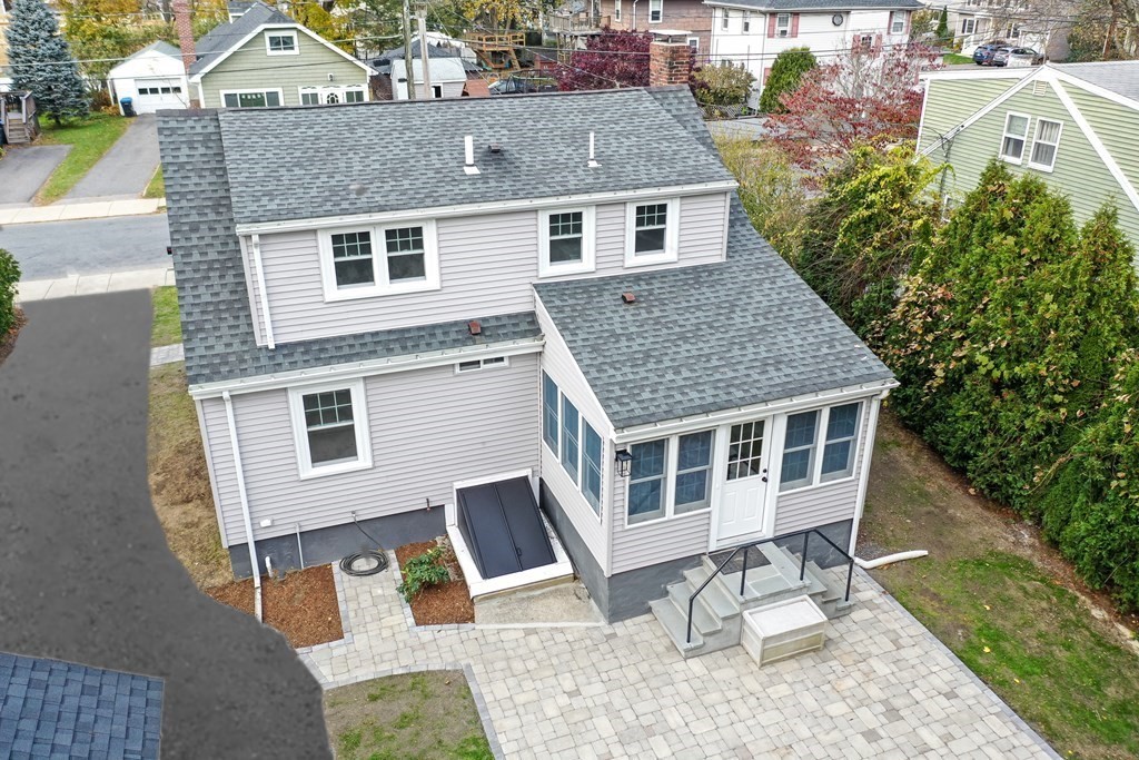2 A Circular Avenue Natick, MA 01760 - Photo 28 of 29 a aerial view of a house with a yard and potted plants