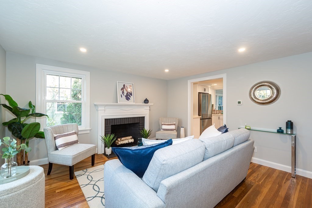 2 A Circular Avenue Natick, MA 01760 - Photo 4 of 29 a living room with furniture and a fireplace