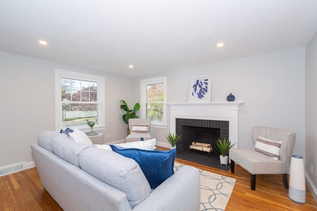 2 A Circular Avenue Natick, MA 01760 - Photo 5 of 29 a living room with furniture and a fireplace