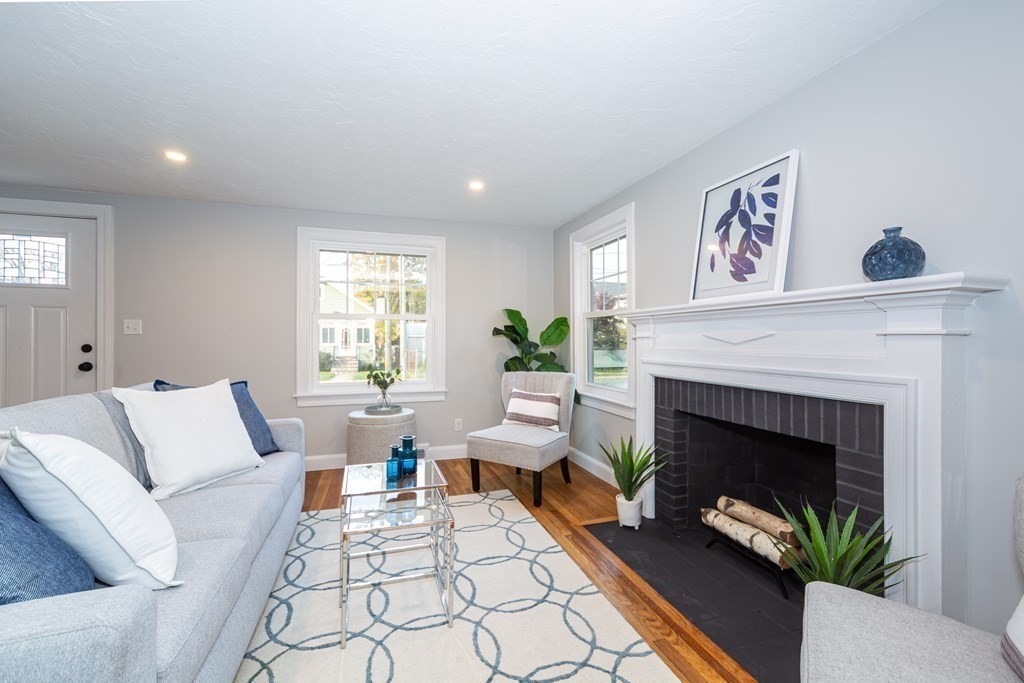 2 A Circular Avenue Natick, MA 01760 - Photo 6 of 29 a living room with furniture and a fireplace