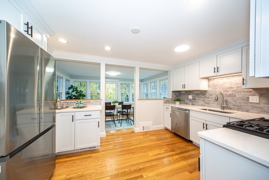 2 A Circular Avenue Natick, MA 01760 - Photo 8 of 29 a large kitchen with kitchen island a sink stainless steel appliances and cabinets