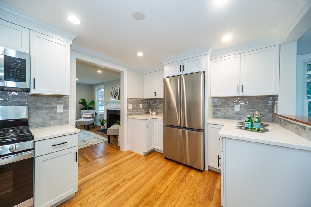 2 A Circular Avenue Natick, MA 01760 - Photo 10 of 29 a kitchen with a refrigerator a stove top oven a sink and dishwasher